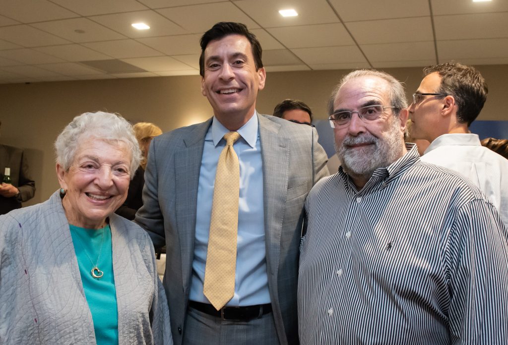 Managing partner Chris Fisher (center) with Marge Feder and Mark Levy
